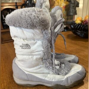 The North Face White and Gray down with faux fur lining.